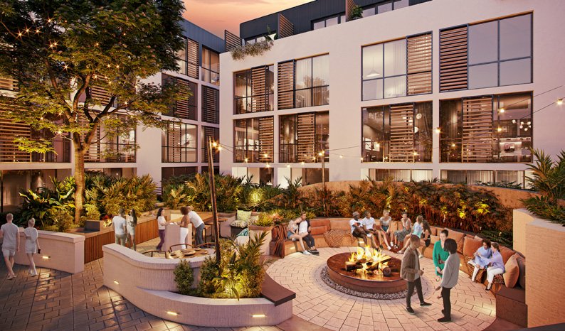 Espace lounge avec foyer extérieur le soir